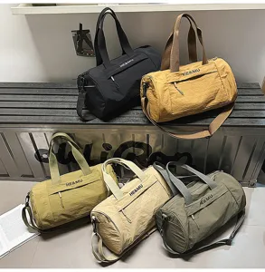 Large capacity cylindrical sports duffel bag, casual travel shoulder bag in multiple colors.