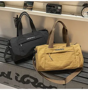 Large capacity gym duffel travel bag for men and women, stylish canvas sports shoulder bag.