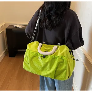 Large capacity travel duffel bag for women and men, neon green gym sports luggage bag.