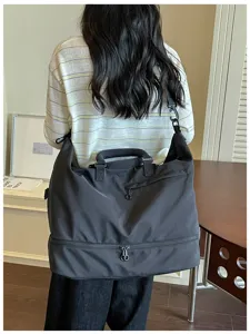 Large capacity travel duffel bag, casual black gym tote with shoe compartment for sports.