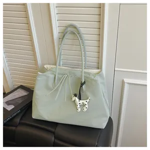 Green large capacity tote bag with shoulder straps, stylish commuter handbag for women.