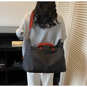 Large capacity travel duffel bag for women and men, ideal for weekend trips, sports, and flight carry-on.