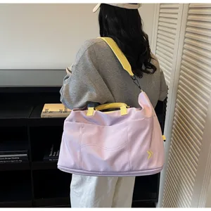 Large capacity travel duffel bag detail showcasing light purple design with yellow straps.