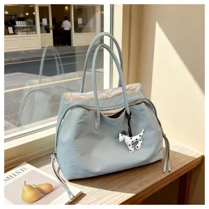 Chic light blue tote bag with cute dog charm, large capacity three-layer commuter shoulder bag.