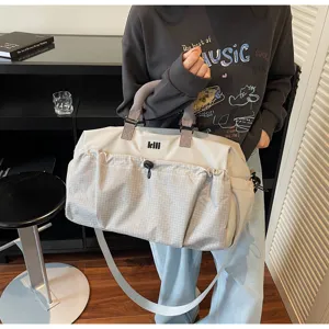 Large capacity travel duffel bag for women and men, lightweight gym sports luggage bag.