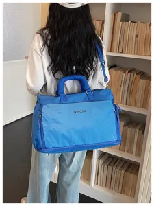 Grand sac de voyage fourre-tout pour femme, sac à bandoulière portable pour voyages de week-end.