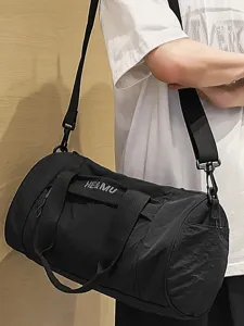 Black cylindrical sports fitness bag, large capacity travel duffel bag with shoulder strap for men and women.