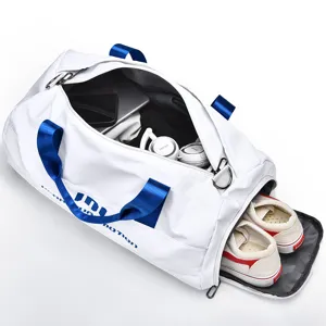 White sports duffel bag with shoe compartment and wet dry separation for gym travel.