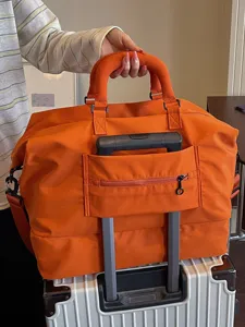 Large capacity travel duffel bag for women, orange gym sports luggage bag, carry on.