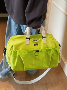 Large capacity travel duffel bag for women and men, gym sports bag with shoulder strap.