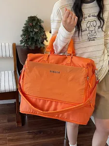 Grand sac de voyage orange cabine sport week-end bagage portable pour femme fitness.