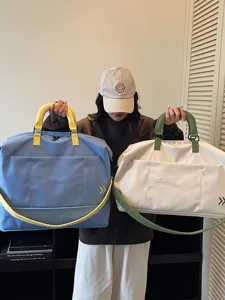 Large capacity travel duffel bag for women and men, lightweight boarding luggage bag.