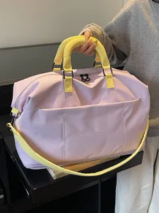 Large capacity travel duffel bag with adjustable strap for gym and short trips.