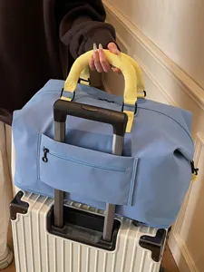 Large capacity travel duffel bag for women and men, weekend overnight bag with trolley sleeve.