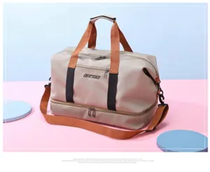 Detail view of the large capacity travel duffel bag showing double-layer storage and sturdy straps.