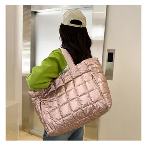 Stylish quilted puffer tote bag for women, shiny pink shoulder bag for travel and daily use.