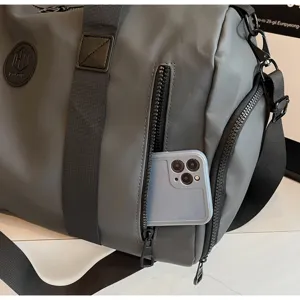Grand sac de voyage gris, sac de sport multifonctionnel avec poche latérale zippée pratique.
