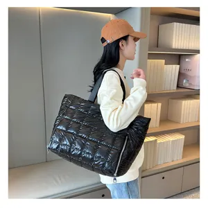 Black quilted puffer tote bag, casual down jacket shoulder bag for travel, yoga and gym use.