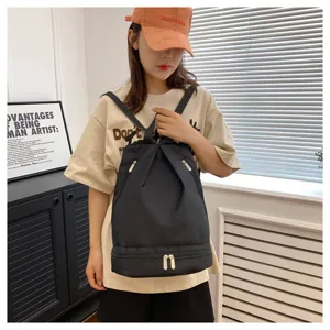 Minimalist black waterproof dry-wet separation backpack detail view for sports and gym use.