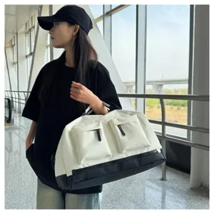 Large capacity gym duffel bag for travel, fitness, and sports with wet dry compartments.