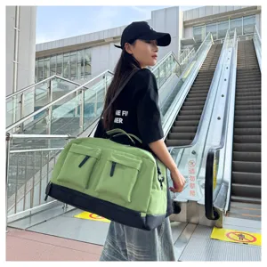 Large capacity sports duffel bag for gym and travel, green canvas weekender with wet pocket.