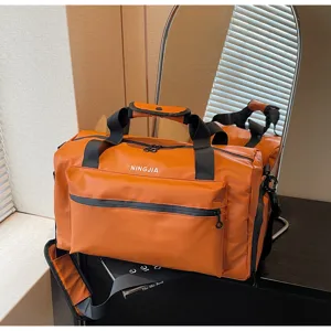 Bolsa de viaje naranja grande con correa, ideal para el gimnasio y fines de semana.
