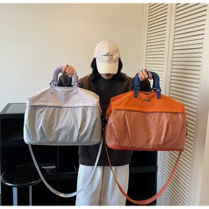 Gran bolsa de viaje y deportiva para mujer y hombre, bolso de mano ligero y amplio.