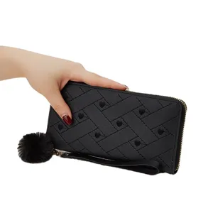 Black quilted women short wallet coin purse with cute pom pom charm and wrist strap.