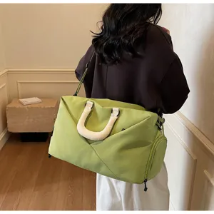 Large capacity sports gym bag and travel duffel with shoulder strap in light green color.
