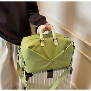 Green travel gym bag with soft padded handles and shoulder strap for short trips and fitness.