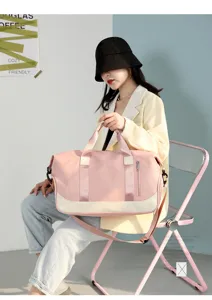 Large capacity travel duffel bag for women, waterproof gym fitness bag with shoulder strap.