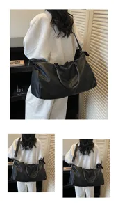 Grande borsa da viaggio nera borsone sportivo per uomo e donna, ideale per palestra e weekend.