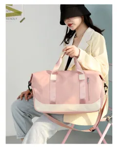 Large capacity pink travel sports duffel bag detail view, stylish gym shoulder bag for women.