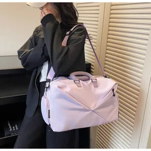 Large capacity travel duffel bag in light purple with shoulder strap for fitness.