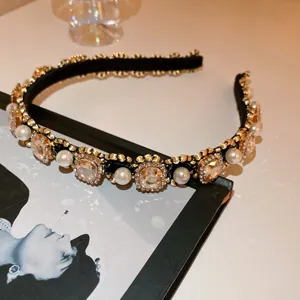 Detail view of a luxury pearl rhinestone headband, elegant French court style hair accessory.