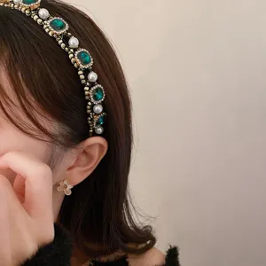 Luxurious French court style pearl and green gem headband with chic flower earrings.