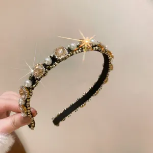 Close up detail of luxury pearl and rhinestone headband, elegant hair accessory design.