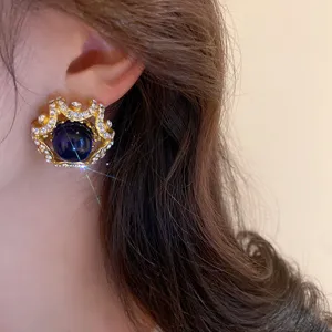 Vintage palace style rhinestone blue ball earrings, elegant clip-on detail for women.