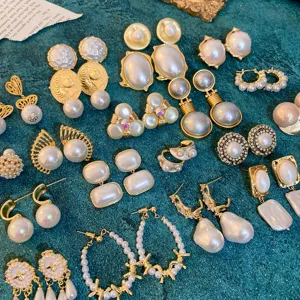 Vintage court style pearl earrings collection featuring baroque pearls and elegant gold studs.
