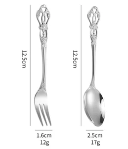 Ensemble de couverts vintage cuillère et fourchette en inox avec manche sculpté 12,5cm.