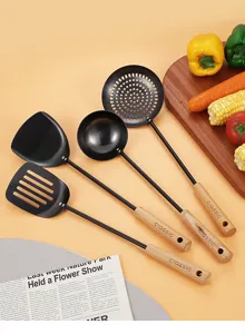 Black iron kitchen utensil set with wooden handle spatula ladle kitchen tool detail view.