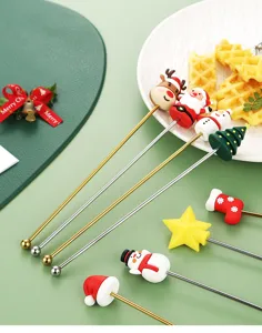 Kerst roerlepel van roestvrij staal detailweergave, schattig tekenfilm pop ontwerp voor koffie.
