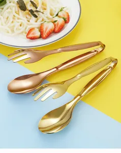 Stainless steel creative hand shaped food tongs kitchen utensil detail view in gold and rose gold.