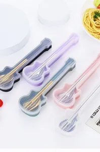 Detailed view of portable guitar cutlery set with stainless steel spoon fork and chopsticks.