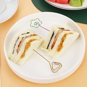 Stainless steel cocktail picks and sandwich fruit forks set for party bar food decor.