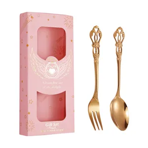 Set de couverts en acier inoxydable doré avec coffret cadeau rose, idéal pour café et desserts.