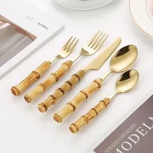 Gold stainless steel flatware set with unique bamboo shaped handles, elegant vintage cutlery.