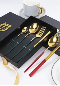 Stainless steel cutlery set detail view, luxury gold and dark green spoons fork gift box.