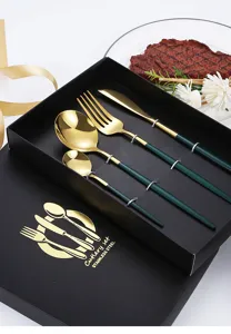 Stainless steel cutlery set with elegant green and gold finish in a luxury gift box.
