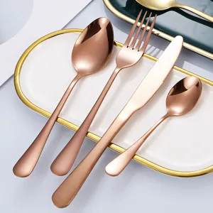 Juego de cubiertos de 4 piezas en acero inoxidable oro rosa, elegante set de cocina.